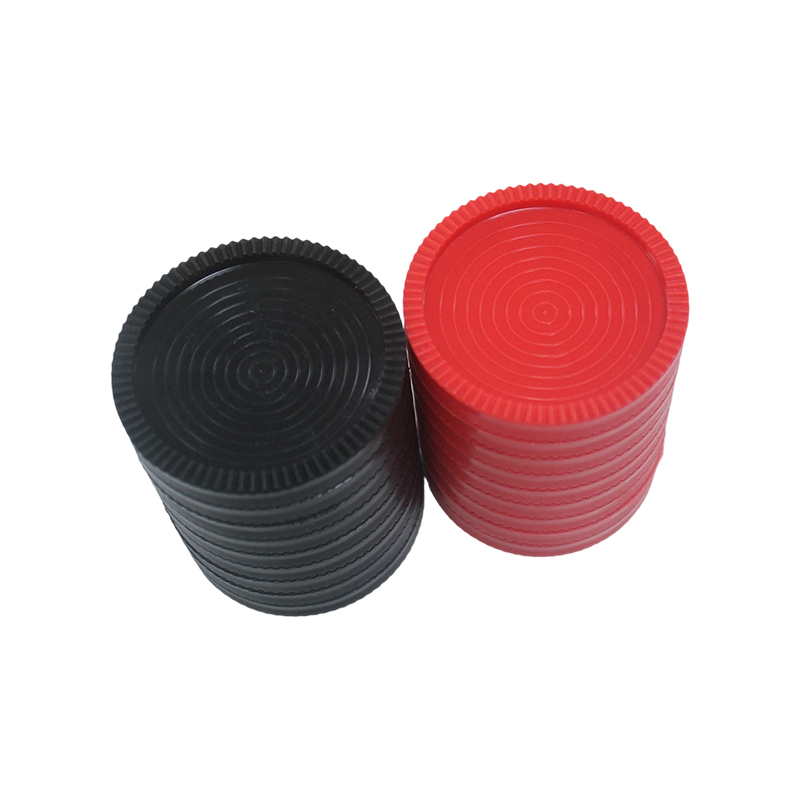 Red and black plastic checkers chess pieces