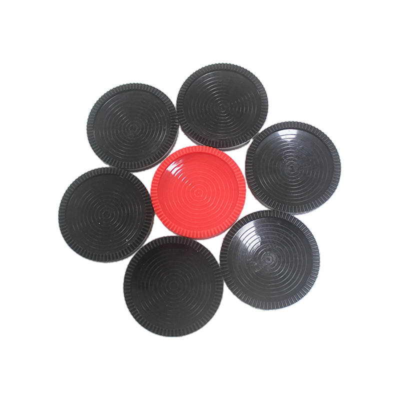 Red and black plastic checkers chess pieces